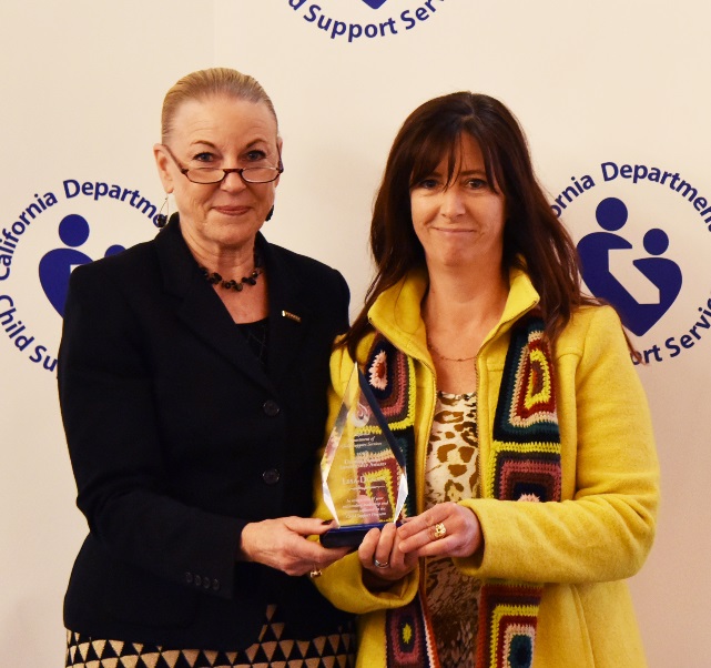 North Coast Regional DCSS Director Lisa Dugan receives the Frahm Leadership Award from California Department of Child Support Services Director Alisha Griffin